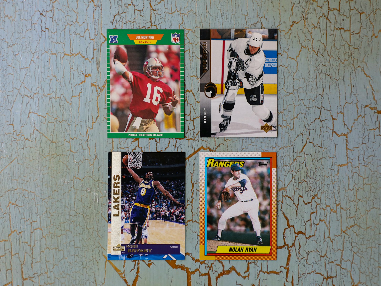 Football card price guide photo showing real sports cards displayed on a wall