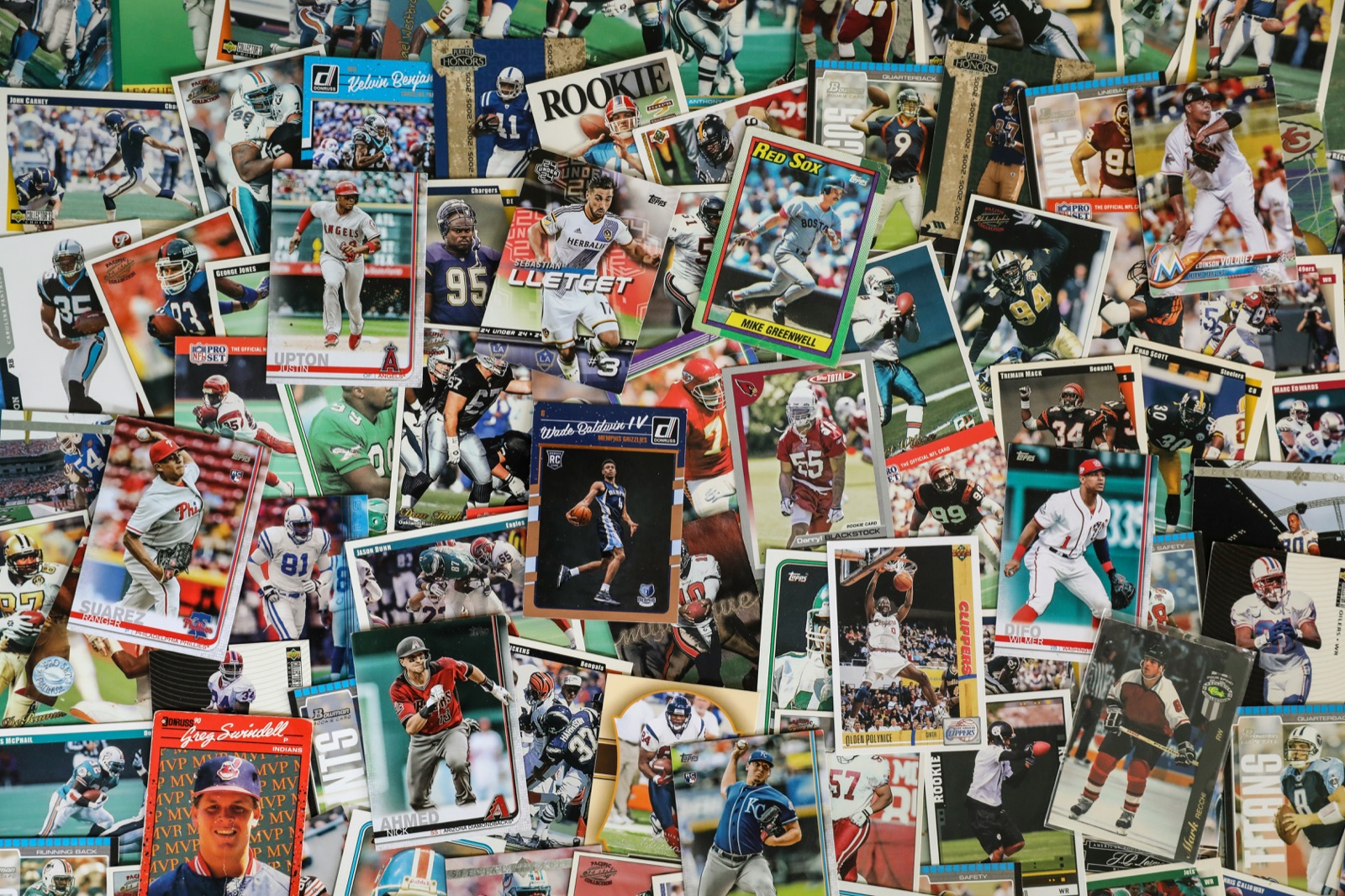 Baseball card price guide photo showing a real sports card collection on a table
